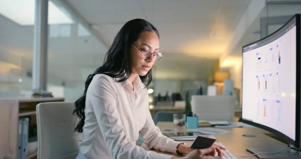 Business, credit card and woman with computer, ecommerce and online shopping in a workplace. Person, employee and consultant with banking, pc and purchase with transaction and payment in an office